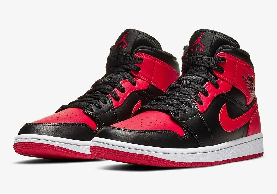  A red and black high-top sneaker with the iconic "Air Jordan" logo on the ankle, worn by Michael Jordan and famously banned by the NBA in 1985.