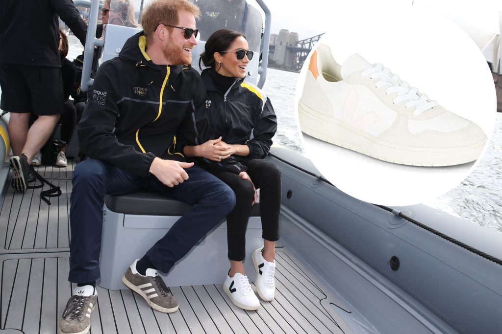 meghan markle wearing Veja sneakers with black fabric upper and white sole, featuring Veja's signature 'V' logo and made with eco-friendly materials. Also spotted price harry in adidas sneakers