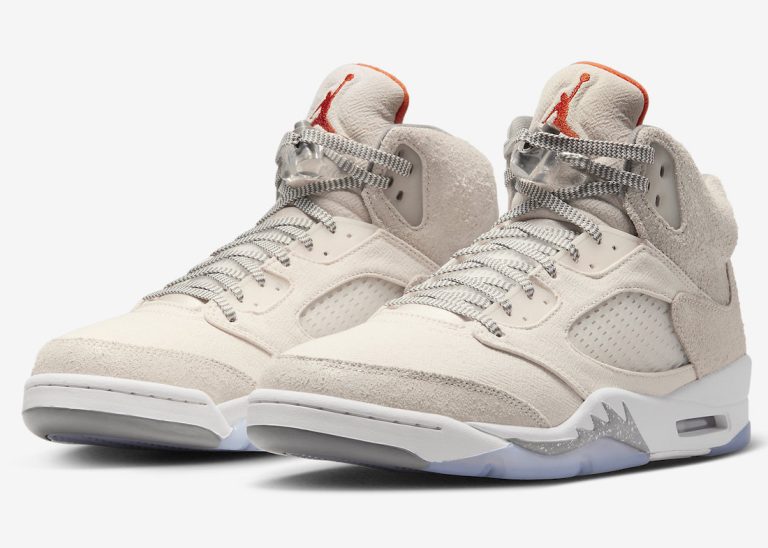 Front view of Air Jordan 5 SE Craft 'Light Orewood Brown' with orange accents on the tongue and white midsole with shark teeth overlays.