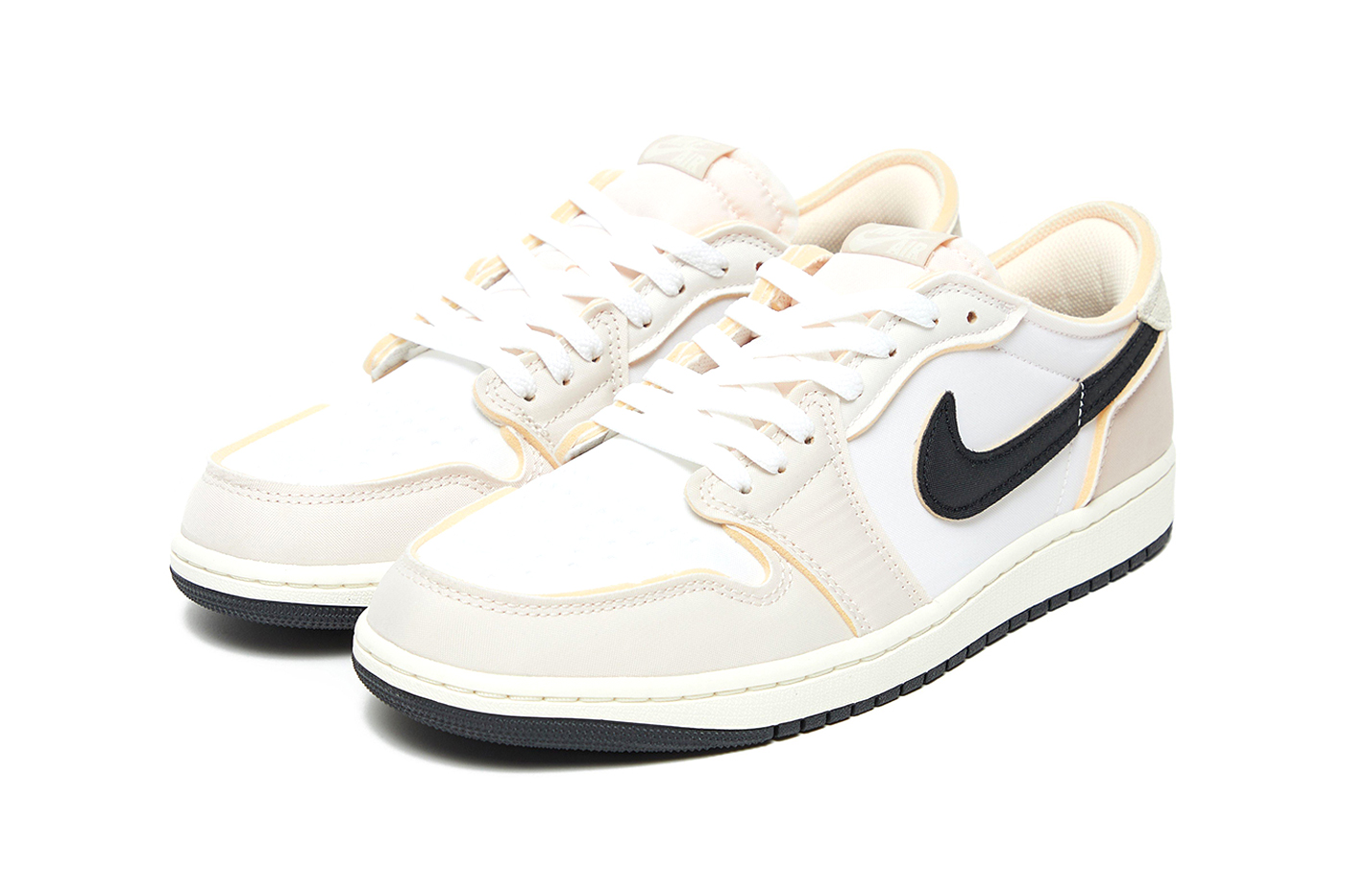 lateral side of Air Jordan 1 Low 'Coconut Milk' sneakers featuring neutral-toned design and enhanced water resistance.