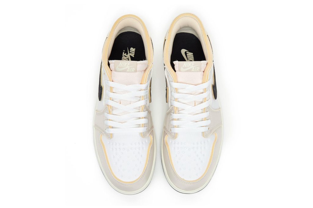 top view of Air Jordan 1 Low 'Coconut Milk' sneakers featuring neutral-toned design and enhanced water resistance.