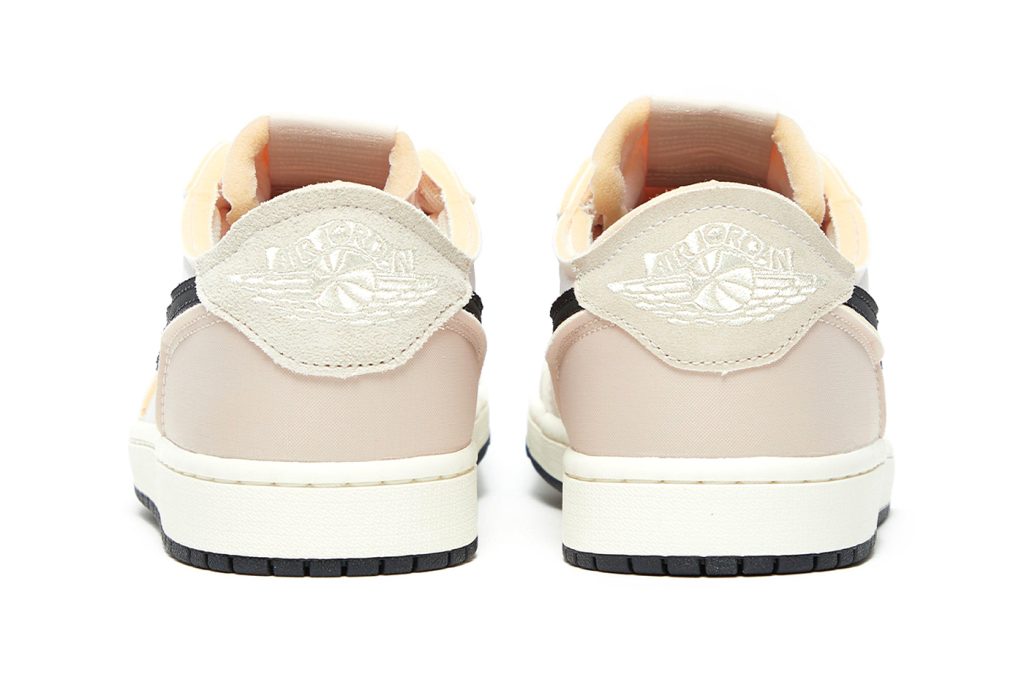 back side  of Air Jordan 1 Low 'Coconut Milk' sneakers featuring neutral-toned design and enhanced water resistance.