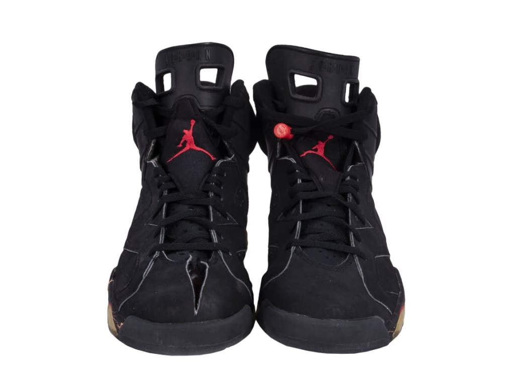  Striking Air Jordan 6 Infrared sneakers worn by Michael Jordan during his first NBA championship victory, showcasing bold design and visual flair.