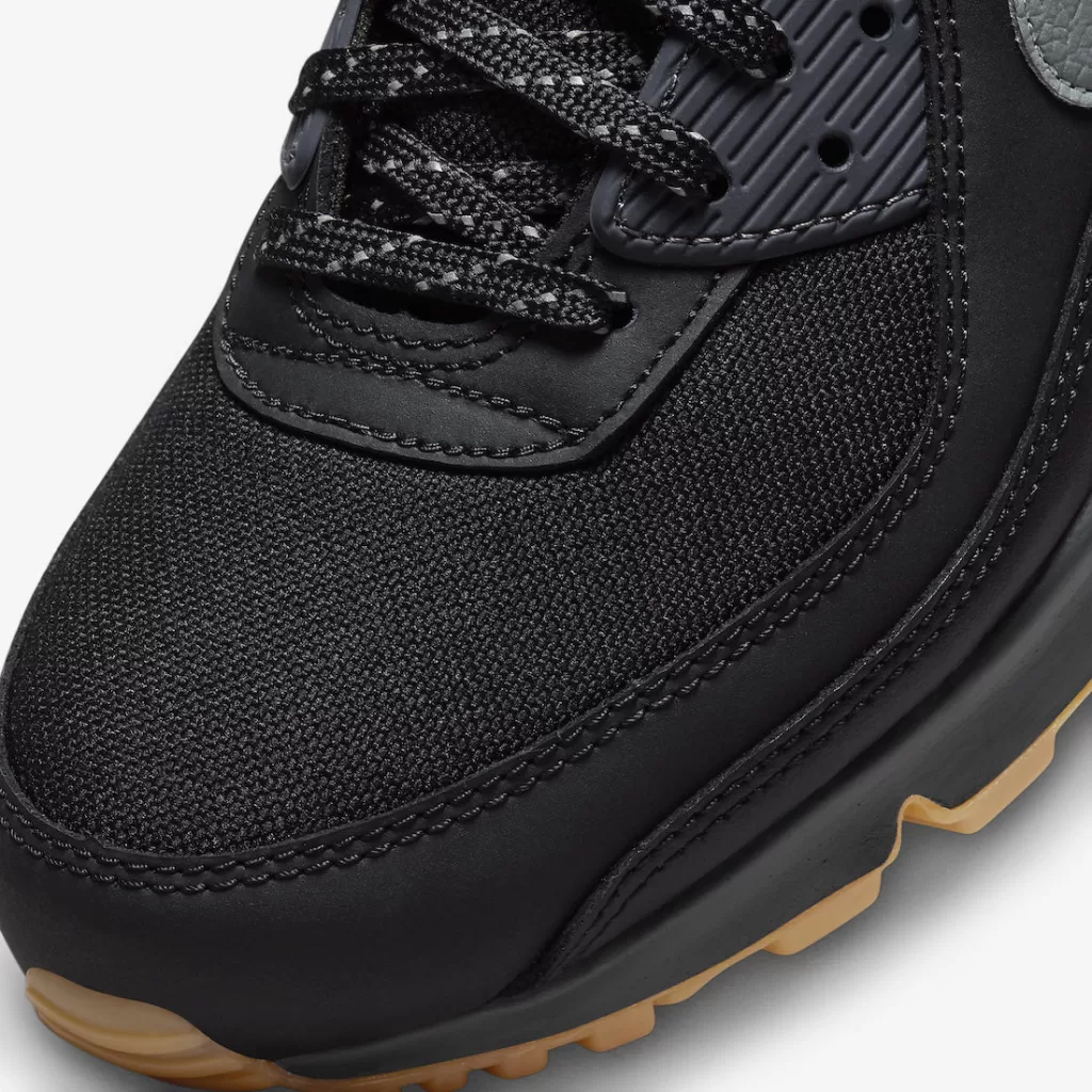 Nike Air Max 90 'Black Gum' featuring black upper, reflective details, and Gum outsole.