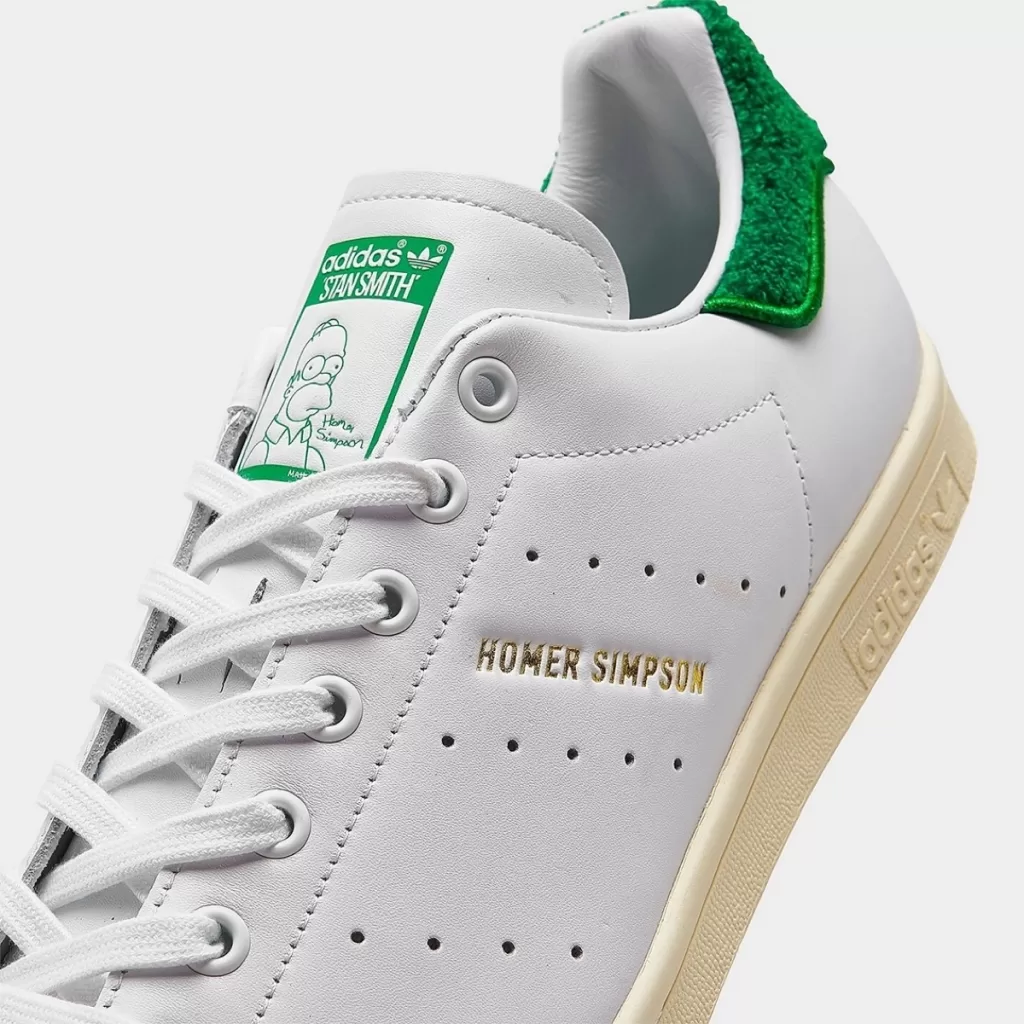 The Simpsons x adidas Stan Smith featuring Homer Simpson meme tribute.
