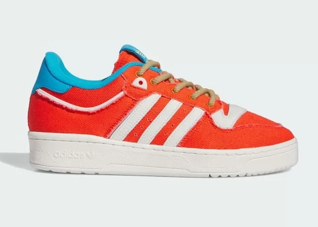 adidas Rivalry Low "Treehouse Of Horrors" sneaker with rough canvas upper, orange, yellow, and blue colorway, and embroidered detailing on the medial mid-panels that show the twins' incision and stitch scars.