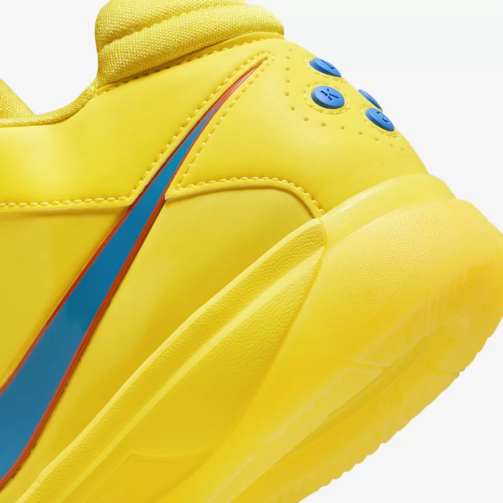 A close-up of the yellow leather upper of the Nike KD 3 "Christmas" sneaker.
