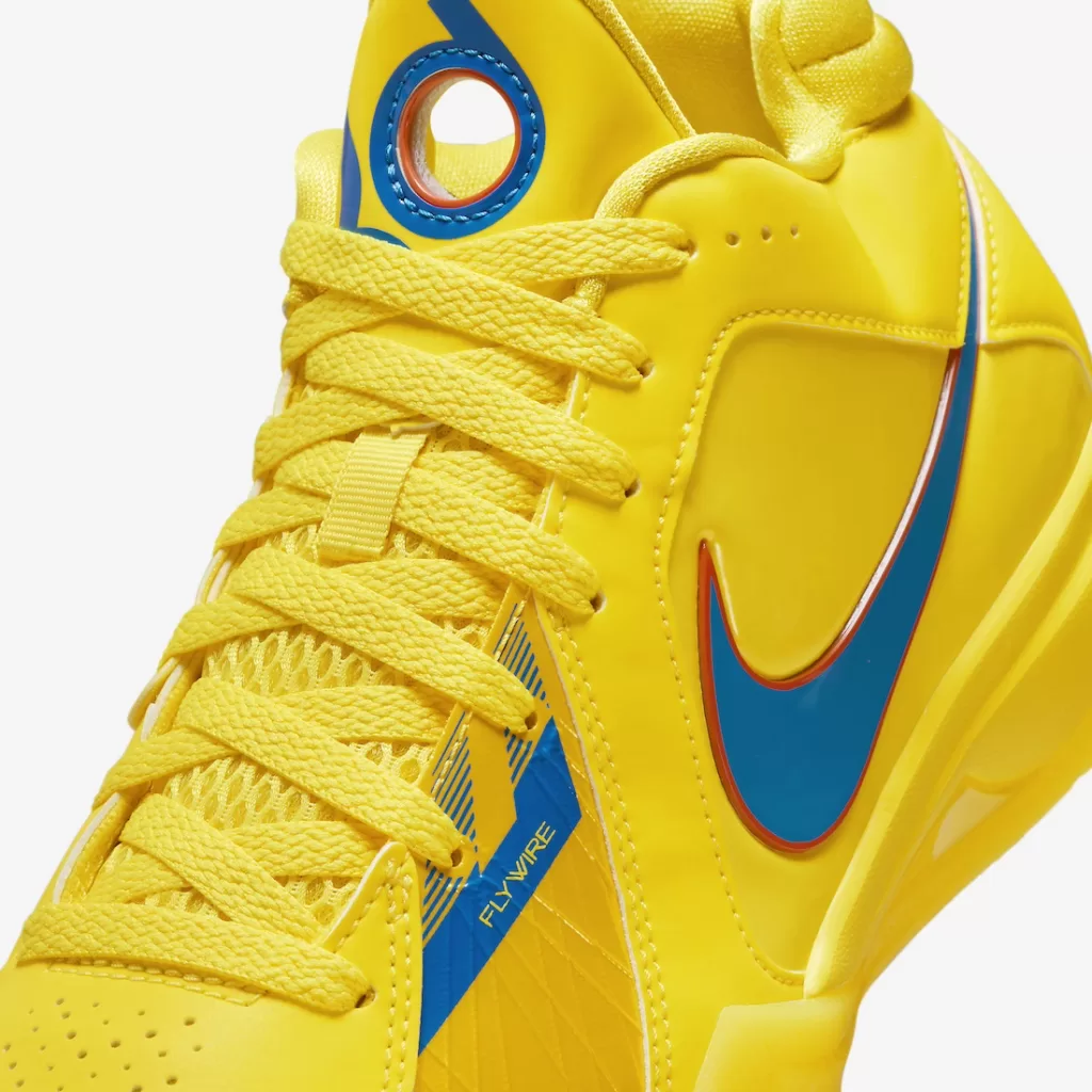 A yellow Nike KD 3 sneaker with a blue Swoosh and orange accents.