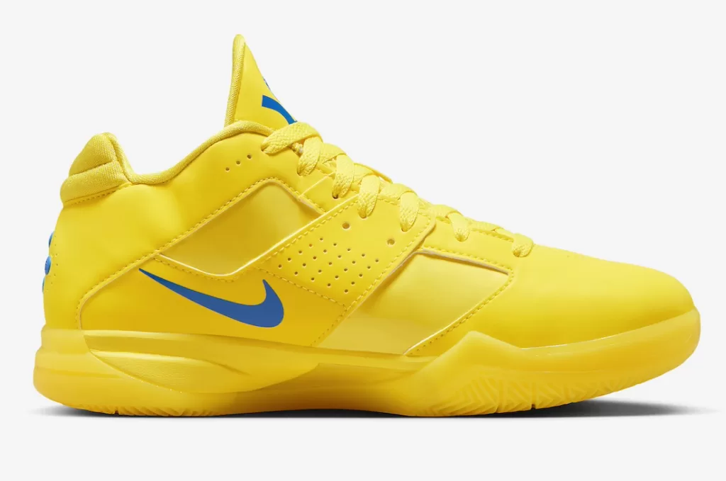 A yellow Nike KD 3 sneaker with a blue Swoosh and orange accents.