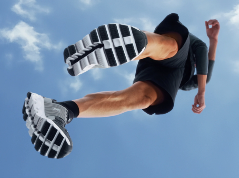on running - cloudtec - A pair of running shoes with a unique cushioning system that consists of hollow pods, aptly named "Clouds." These Clouds compress both horizontally and vertically to absorb impact and propel the runner forward with each stride.