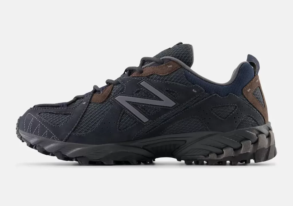 New Balance 610T "Phantom/Blacktop" sneaker with a breathable mesh base and suede and fabric overlays in a black and navy colorway. Brown accents on the tongue and spine. Grey "N" logos. Blacktop midsole and outsole.