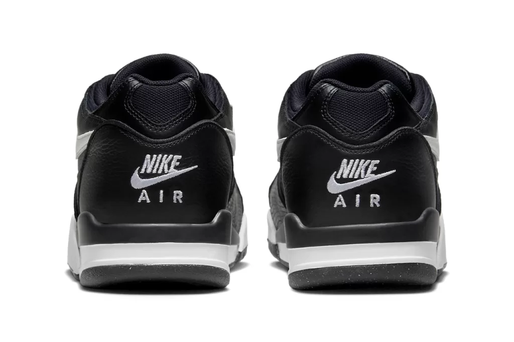 A timeless combination of black and white, this colorway exudes a sophisticated yet understated vibe. The black leather upper is complemented by white Swooshes, tongue, and heel tab, while the snakeskin overlays provide a subtle hint of texture. The Air Jordan 4-inspired sole completes the look with a touch of retro flair.