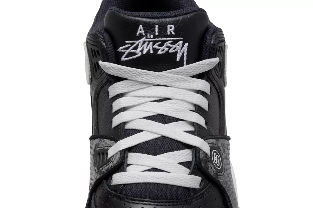 A timeless combination of black and white, this colorway exudes a sophisticated yet understated vibe. The black leather upper is complemented by white Swooshes, tongue, and heel tab, while the snakeskin overlays provide a subtle hint of texture. The Air Jordan 4-inspired sole completes the look with a touch of retro flair.