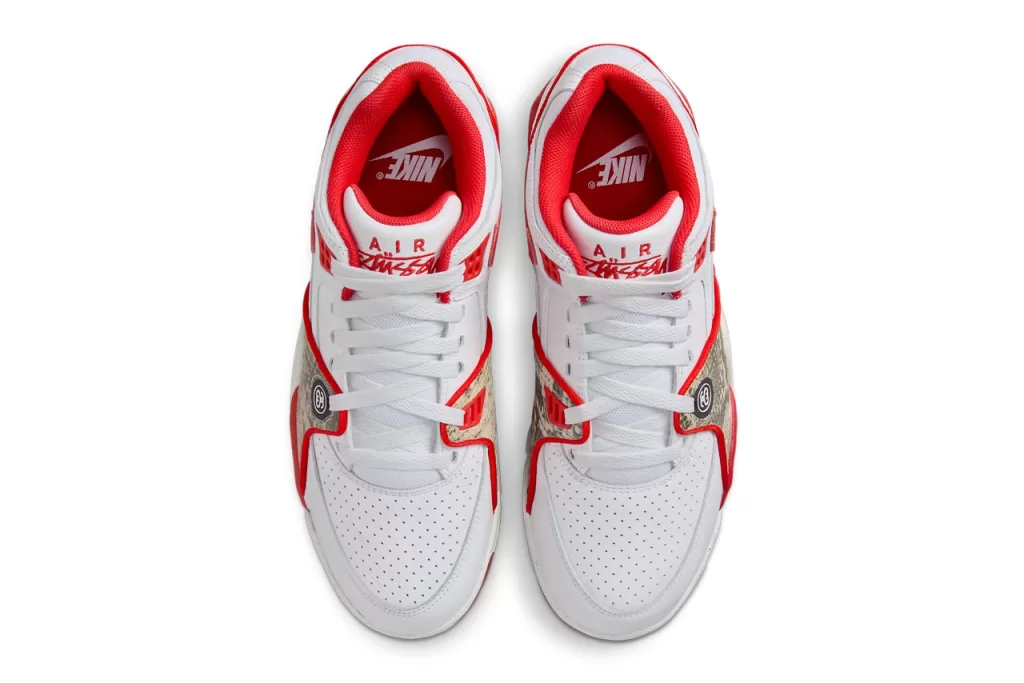 Stussy x Nike Air Flight 89 "White/Habanero Red" - A vibrant take on the classic Air Flight 89, this colorway features a crisp white leather upper with striking habanero red accents on the Swoosh, tongue, and heel tab. The snakeskin overlays on the sides add a touch of luxury, while the Air Jordan 4-inspired sole provides both cushioning and style.