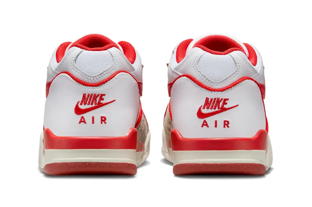 Stussy x Nike Air Flight 89 "White/Habanero Red" - A vibrant take on the classic Air Flight 89, this colorway features a crisp white leather upper with striking habanero red accents on the Swoosh, tongue, and heel tab. The snakeskin overlays on the sides add a touch of luxury, while the Air Jordan 4-inspired sole provides both cushioning and style.