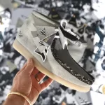 JAY-Z & crew rock 50 years of hip-hop in bespoke Wallabees! Stan Birch crafts one-of-a-kind kicks for legends like Emory Jones, Tyran "Ty-Ty" Smith & more. See personalized details & lyrics.