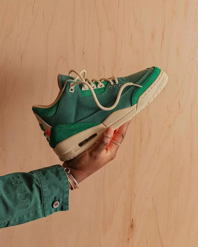 Get a first look at Nina Chanel Abney's highly-anticipated collaboration with Jordan Brand on the Air Jordan 3. This unique design features a two-toned green upper, custom details, and a potential matching apparel collection.